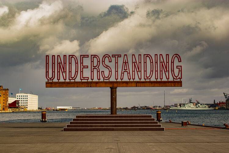 A large sign that says understanding..